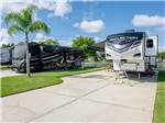 A fifth wheel RV in a paved site - thumbnail