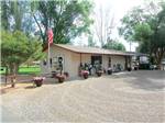 View larger image of Flag pole next to office at campground at SUNDANCE RV PARK image #1