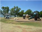 View larger image of Playground with swing at LOYD PARK CAMPING CABINS  LODGE image #6