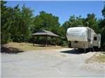 View larger image of Picnic table and trailer at LOYD PARK CAMPING CABINS  LODGE image #11