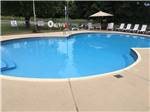 View larger image of The clean pool with chairs at OUTBACK RV RESORT image #4