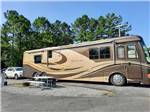 View larger image of A motorhome in an RV site at OUTBACK RV RESORT image #8