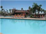 View larger image of Swimming pool with outdoor seating at GOOD LIFE RV RESORT image #10