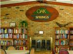 View larger image of The lending library with fireplace at OAK SPRINGS RV RESORT image #5