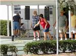 View larger image of A group of people playing shuffleboard at BLUE PARROT RV RESORT image #7