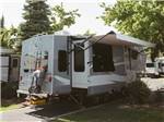 Motorhome in a campsite at ALDERWOOD RV PARK - thumbnail