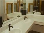 Multiple sinks inside the bathroom at ALDERWOOD RV PARK - thumbnail