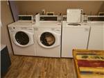 Laundry room with washers and dryers at ALDERWOOD RV PARK - thumbnail