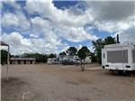 A row of gravel RV sites at STAMPEDE RV PARK - thumbnail