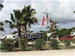 View larger image of A flag pole sitting in front of RV sites at SEA BREEZE RV COMMUNITY RESORT image #7