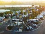 Aerial view parked RVs, palm trees and water at GOLDEN SHORE RV RESORT - thumbnail