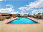 The swimming pool with lounge chairs at LAS QUINTAS RV RESORT - thumbnail