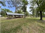 A covered pavilion with trees at RIVERS EDGE RV CAMPGROUND - thumbnail
