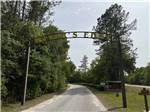 A sign over the front entrance road at RIVERS EDGE RV CAMPGROUND - thumbnail