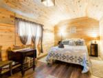 The bed inside one of the cabin rentals at CARDWELL GENERAL STORE AND CAMPGROUND - thumbnail