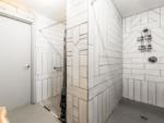 The inside of the clean shower stalls at CARDWELL GENERAL STORE AND CAMPGROUND - thumbnail