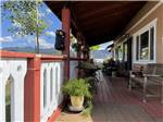 A covered porch with seating - thumbnail