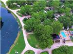 Aerial view over campground and lake at PIN OAK RV RESORT BY RJOURNEY - thumbnail
