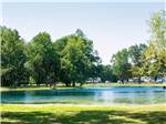 A view of the lake next to the sites at PIN OAK RV RESORT BY RJOURNEY - thumbnail