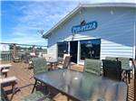 Outdoor deck for dining at local pizza place at OSPREY POINT RV RESORT - thumbnail