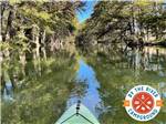 A kayak on the river at BY THE RIVER RV PARK & CAMPGROUND - thumbnail