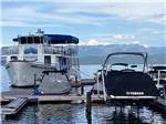 View larger image of A group of boats on the dock at FLATHEAD HARBOR RV LUXURY CONDOS AND CABINS FORMERLY EDGEWATER RESORT image #9