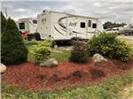 View larger image of A travel trailer in an RV site at GROS MORNENORRIS POINT KOA image #6