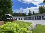 View larger image of Hotel with green meadow and trees at CAMPING RIMOUSKI image #10