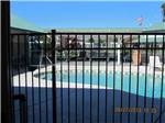 View larger image of The fenced in pool area at ALMOND TREE RV PARK image #2