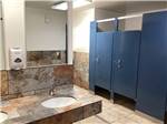 View larger image of The bathroom stalls and sinks at HAGERMAN RV VILLAGE image #11