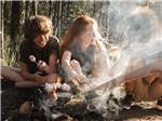 View larger image of Children roasting marshmallows at APPLE ISLAND RESORT image #10