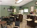 View larger image of  The kitchen area with tables and chairs at COUNTRY SIDE RV PARK image #5