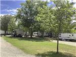 View larger image of Gravel roads with trees next to the gravel sites at COUNTRY SIDE RV PARK image #11
