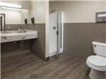 View larger image of A very clean bathroom with a shower at ARIZONA CHARLIES BOULDER RV PARK image #7