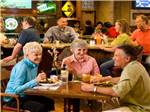 People dining at tables at Arizona Charlie's Boulder RV Park - thumbnail