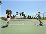 View larger image of Couples playing pickleball at TOBYS RV RESORT image #2