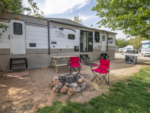 Red chairs outside a camper at Moab RV & Glamping Resort - thumbnail