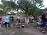 People sitting on lawn chairs at PATO BLANCO LAKES RV RESORT - thumbnail