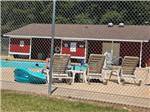 View larger image of Lounge chairs next to the pool at HO-CHUNK RV RESORT  CAMPGROUND image #7