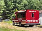 View larger image of Red bus parked outside at HO-CHUNK RV RESORT  CAMPGROUND image #9