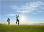View larger image of A couple of people playing golf at WILDHORSE RESORT  CASINO RV PARK image #8