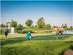 View larger image of A group of four people playing golf at WILDHORSE RESORT  CASINO RV PARK image #11