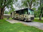 Motorhome in a gravel site at SPRING LAKE RV RESORT - thumbnail