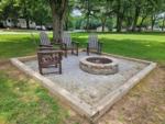 Chairs around a fire pit at SPRING LAKE RV RESORT - thumbnail