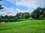 View of the trees by the lake at SPRING LAKE RV RESORT - thumbnail