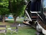 Parked RV at site Junius Ponds Cabins & Campground - thumbnail