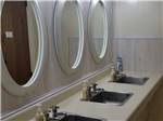 The sinks and mirrors in the bathroom at RESTWAY TRAVEL PARK - thumbnail