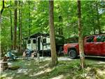 People sitting outside of their trailer at WOODSMOKE CAMPGROUND - thumbnail