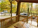 A wooden deck overlooking the RV sites at WOODSMOKE CAMPGROUND - thumbnail