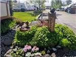 View larger image of Landscaping and sign outside main office at ELMA RV PARK image #7